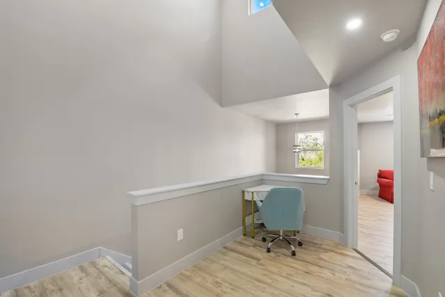 a workspace with furniture and a window