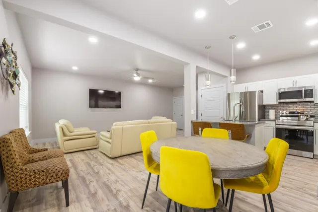 a living room with furniture and a table