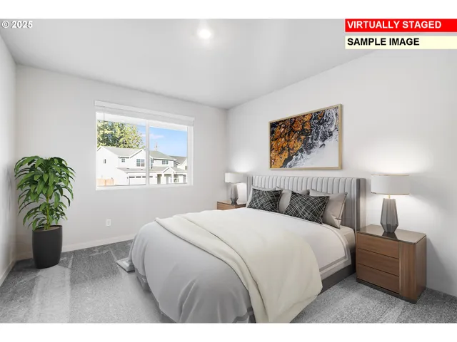 a bedroom with a bed and a potted plant