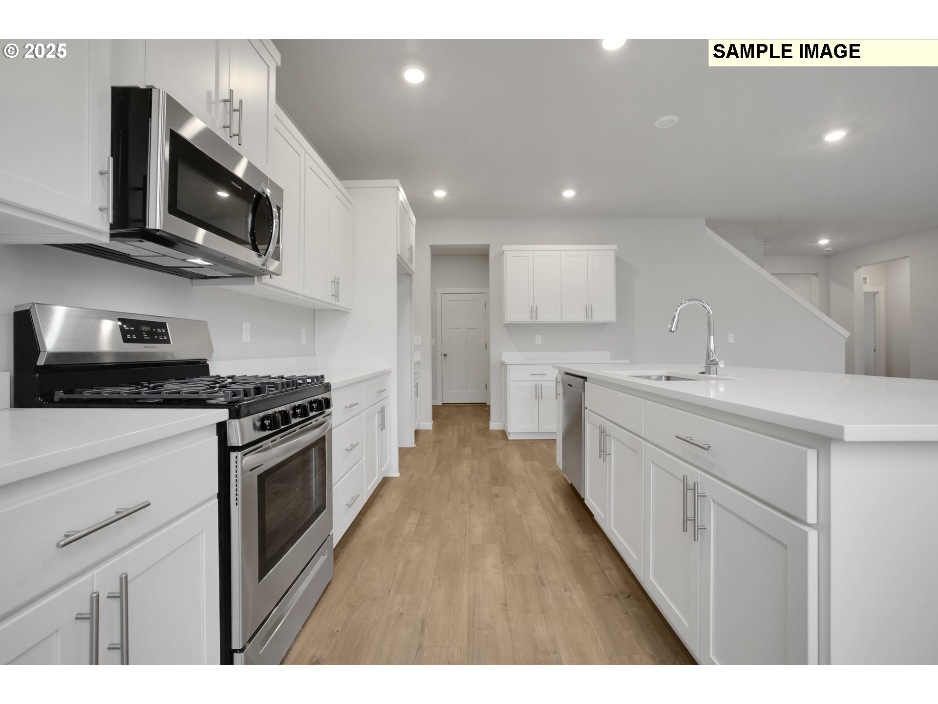 792 Misty Lane Forest Grove, OR 97116 - Photo 24 of 30 a kitchen with stainless steel appliances granite countertop a sink a stove top oven a counter space and cabinets