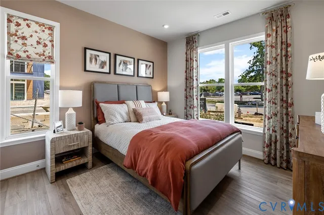 a bed room with a bed and a large window