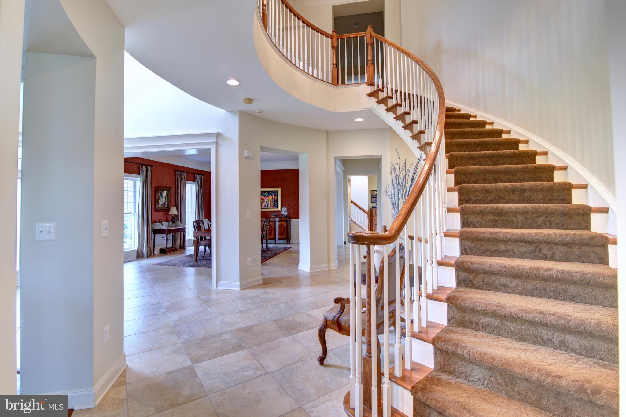22077 Oatlands Road Aldie, VA 20105 - Photo 9 of 51 With Curved Staircase and Overlook