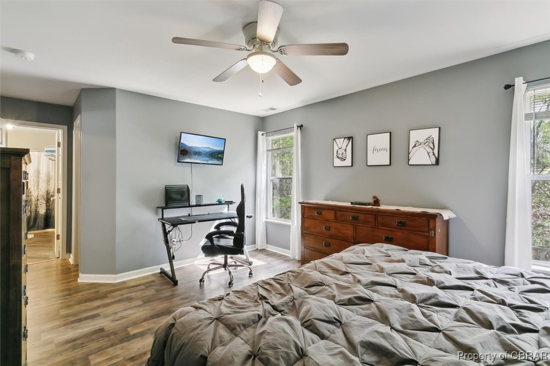 127 Low Ridge Road Williamsburg, VA 23185 - Photo 21 of 35 Bedroom featuring baseboards, a ceiling fan, and wood finished floors