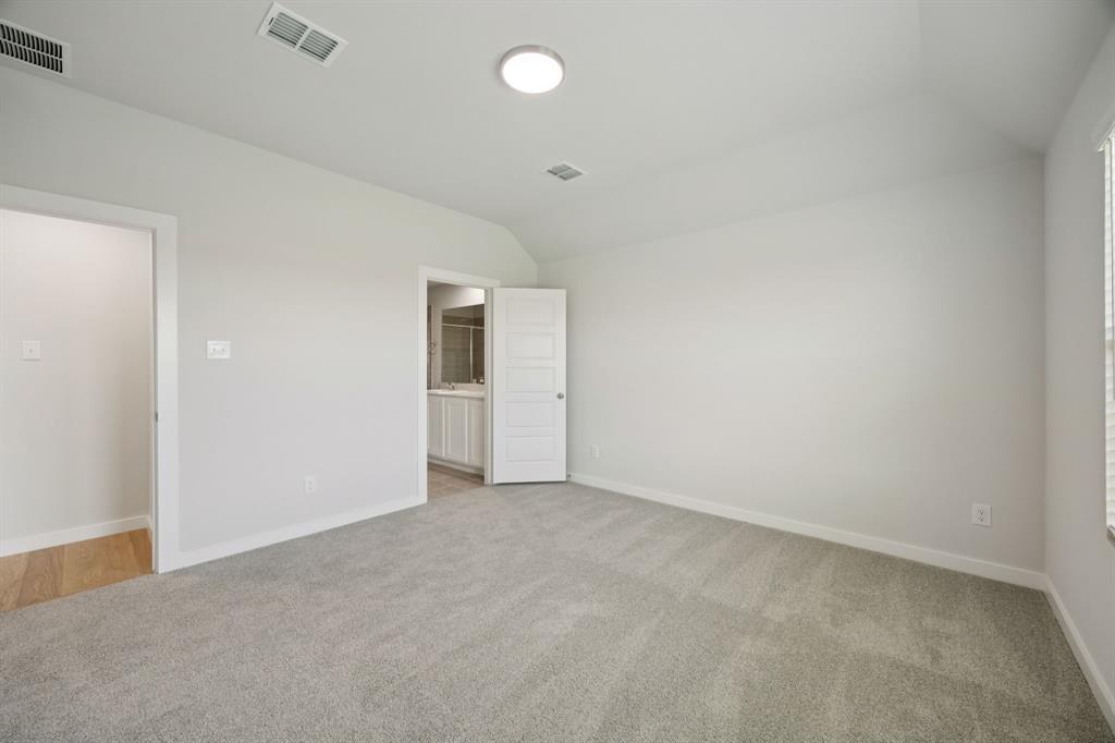 853 Rockcloud Drive Haslet, TX 76052 - Photo 12 of 27 Primary Suite in the Hadley home plan by Trophy Signature Homes – REPRESENTATIVE PHOTO