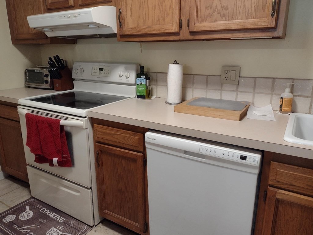 48 Evergreen Road, Unit 311 Leeds, MA 01053 - Photo 11 of 26 a kitchen with a sink and cabinets