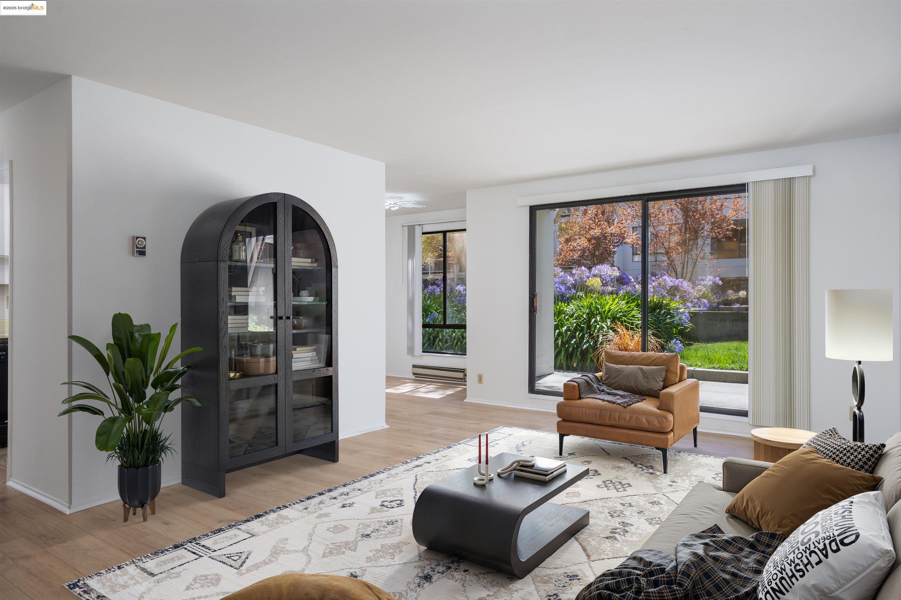 Sitting room featuring light wood finished floors and baseboards