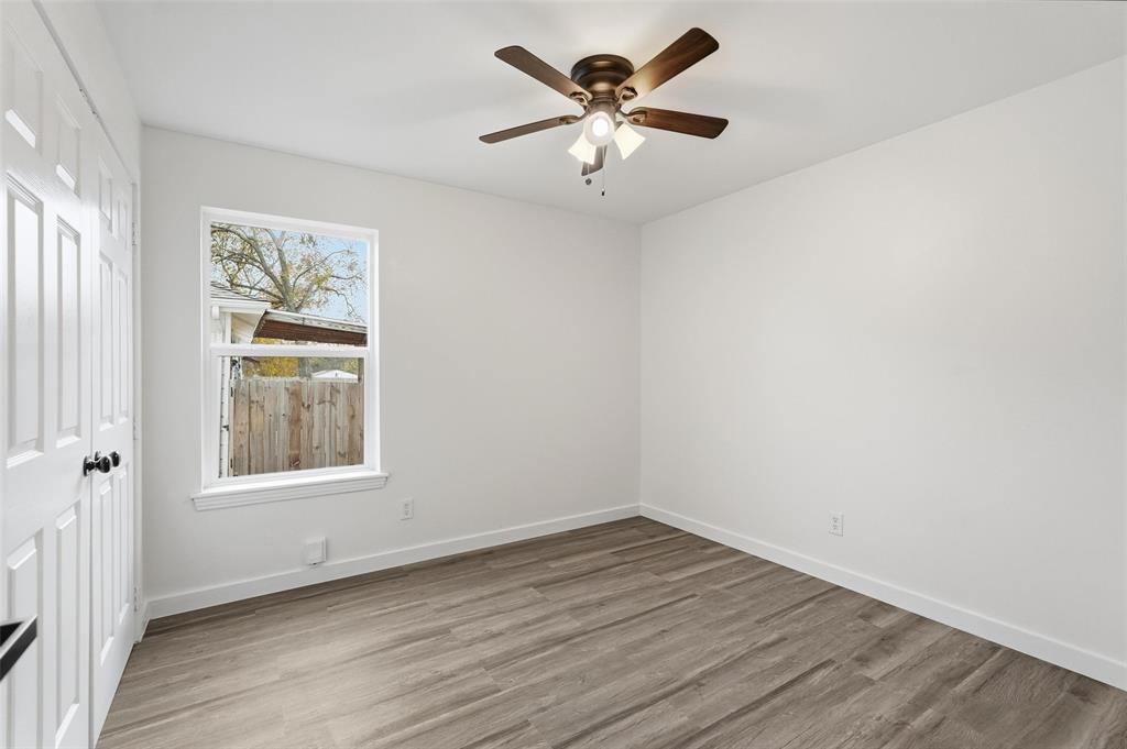 513 Paddy Street Mesquite, TX 75149 - Photo 14 of 18 wooden floor in an empty room with a window