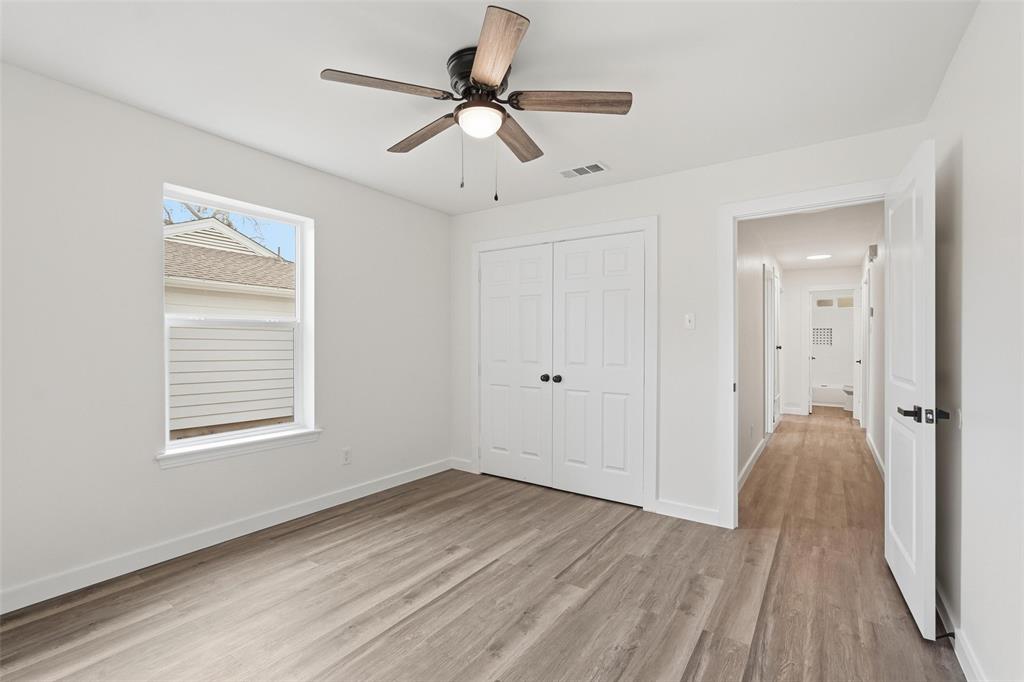 513 Paddy Street Mesquite, TX 75149 - Photo 15 of 18 a view of a room with wooden floor and a ceiling fan