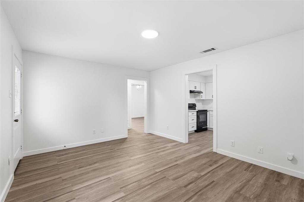 513 Paddy Street Mesquite, TX 75149 - Photo 5 of 18 a view of empty room with wooden floor
