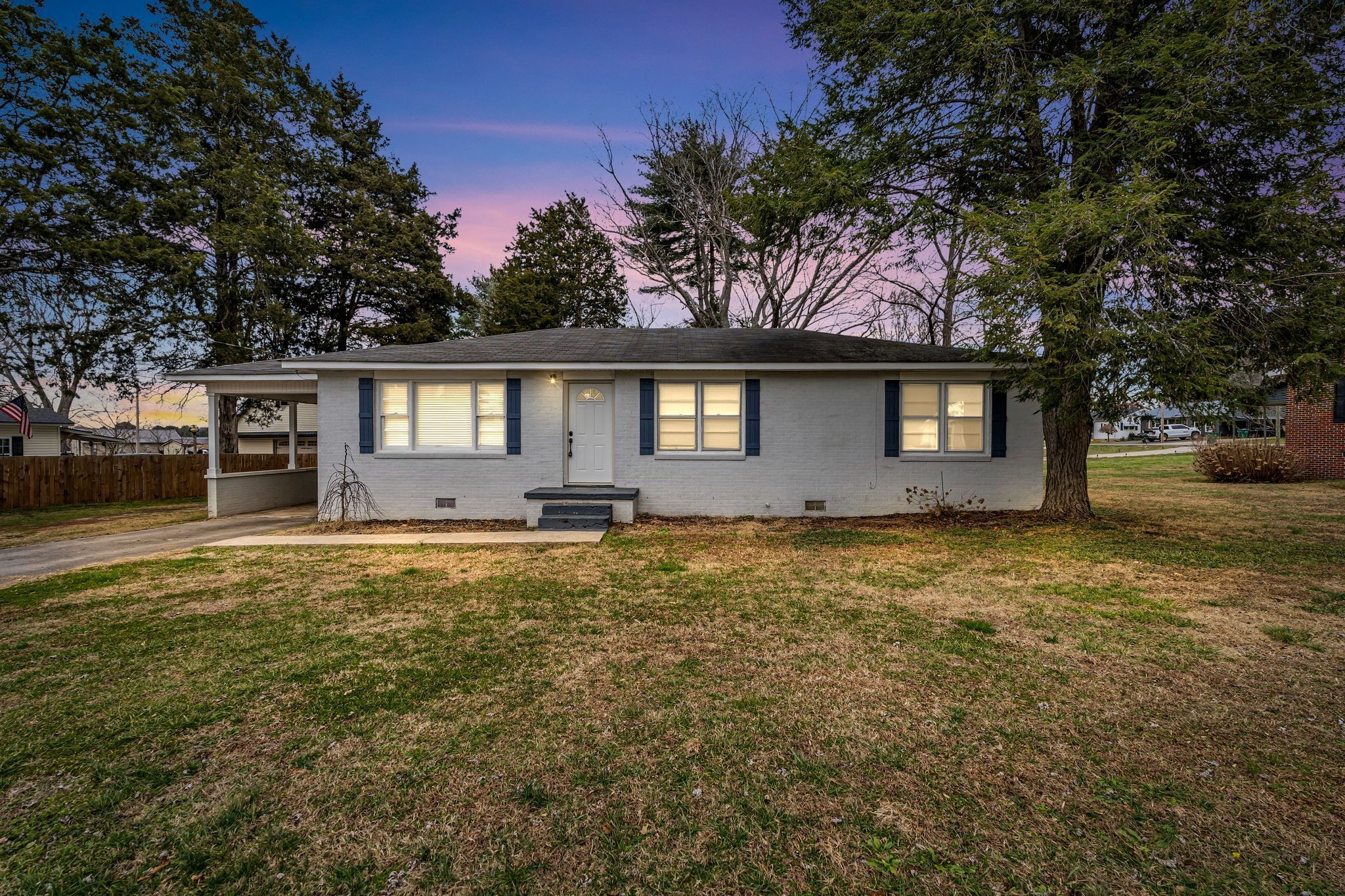 1102 North High Street Winchester, TN 37398 - Photo 1 of 27 a front view of a house with a garden