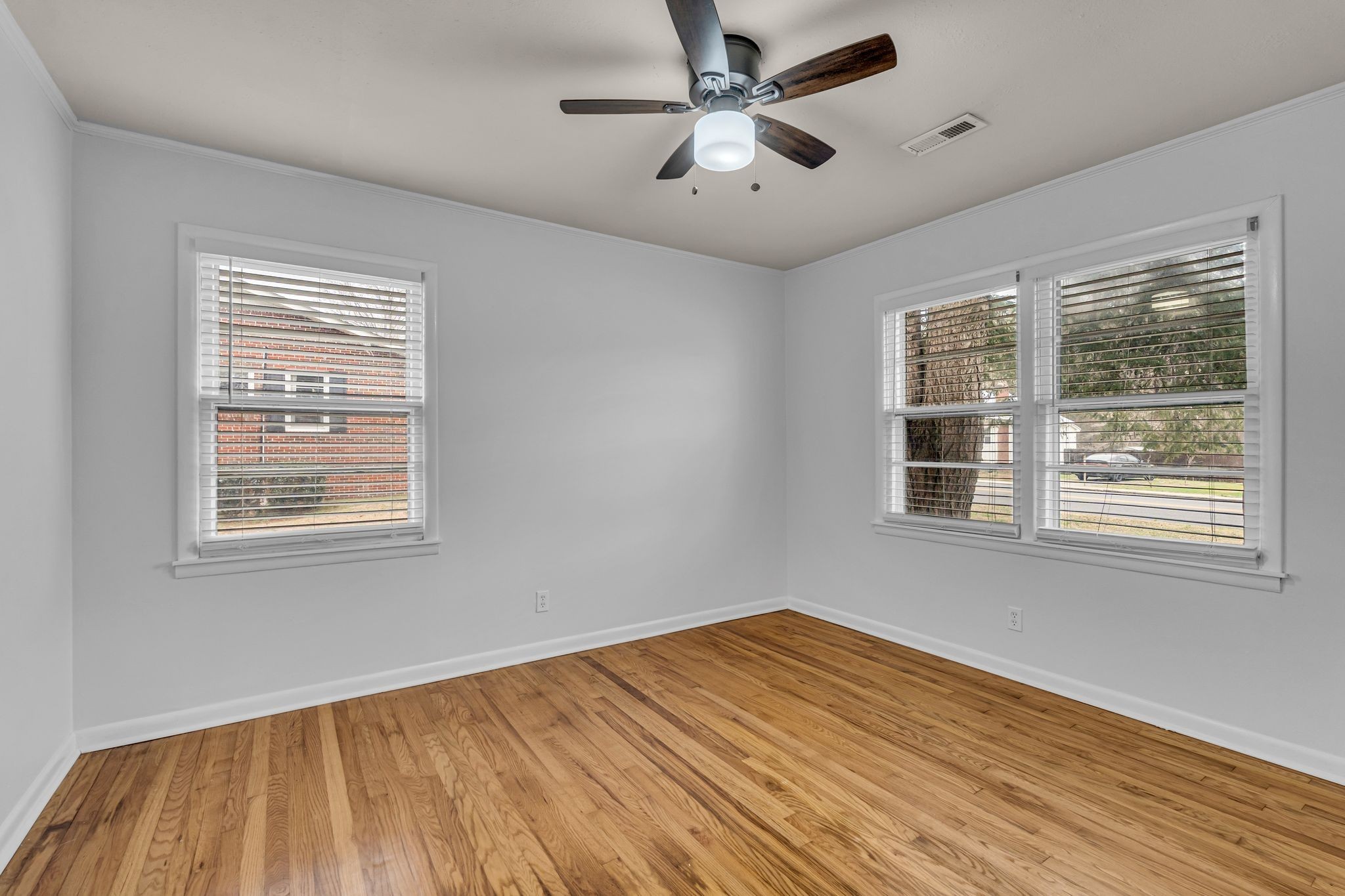 1102 North High Street Winchester, TN 37398 - Photo 14 of 27 a view of empty room with wooden floor and fan
