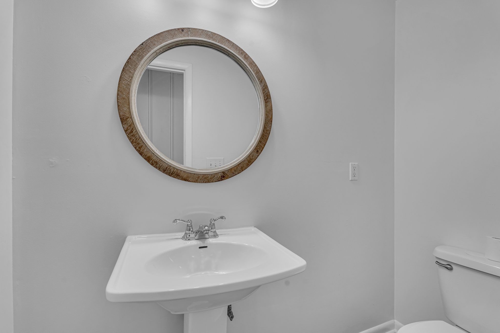 1102 North High Street Winchester, TN 37398 - Photo 19 of 27 a bathroom with a sink and a mirror