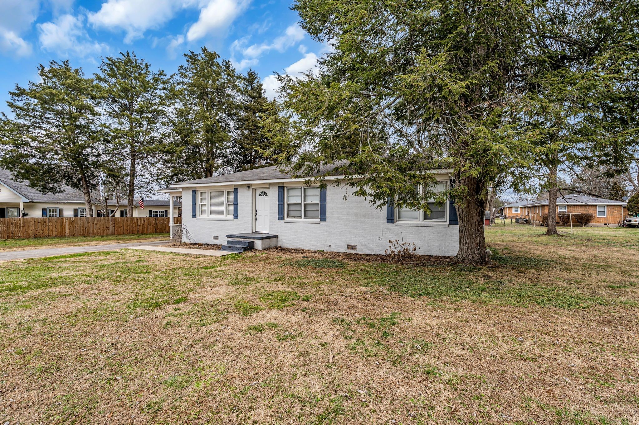1102 North High Street Winchester, TN 37398 - Photo 2 of 27 a house with trees in front of it
