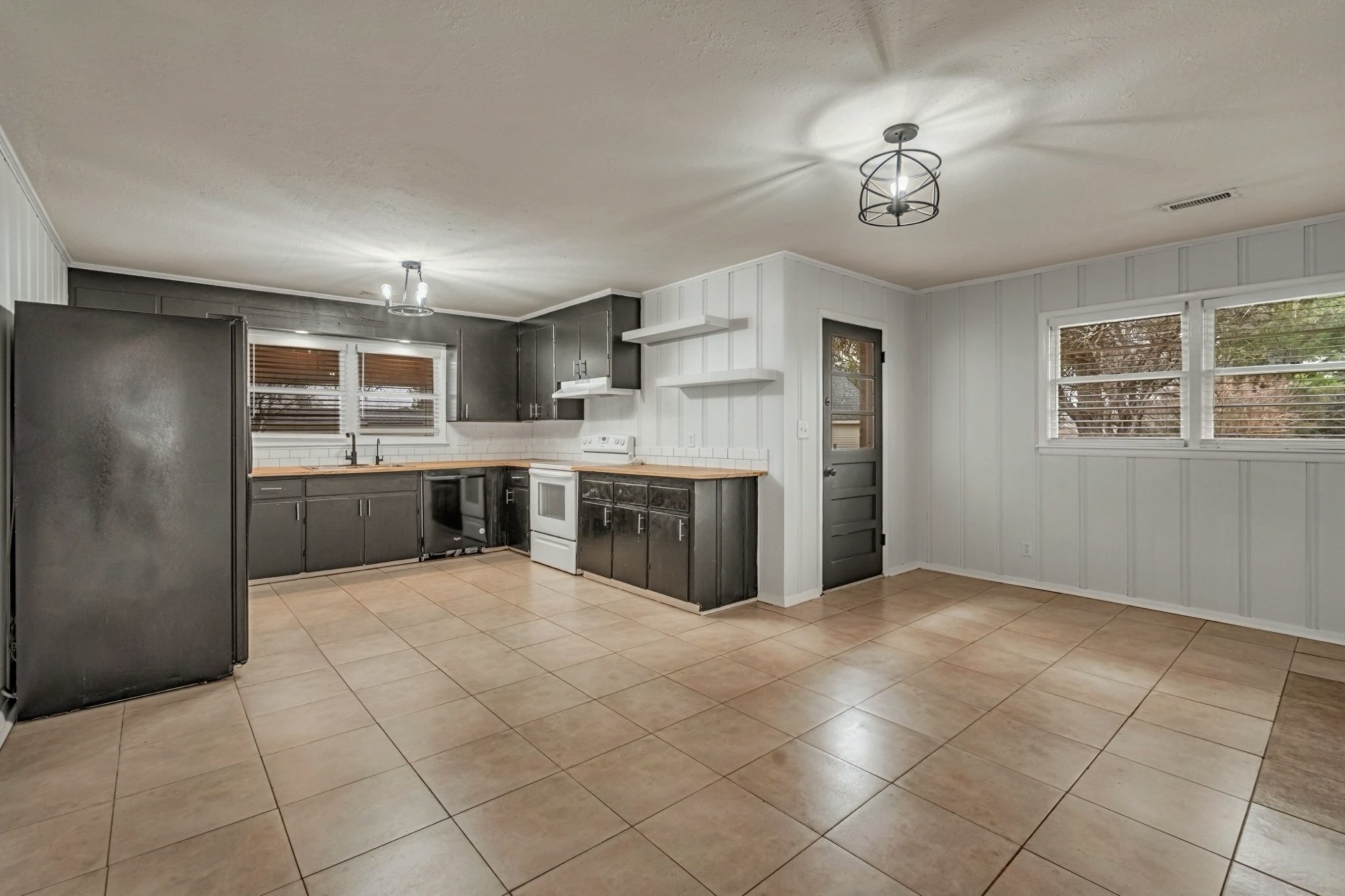 1102 North High Street Winchester, TN 37398 - Photo 6 of 27 a large kitchen with cabinets and stainless steel appliances