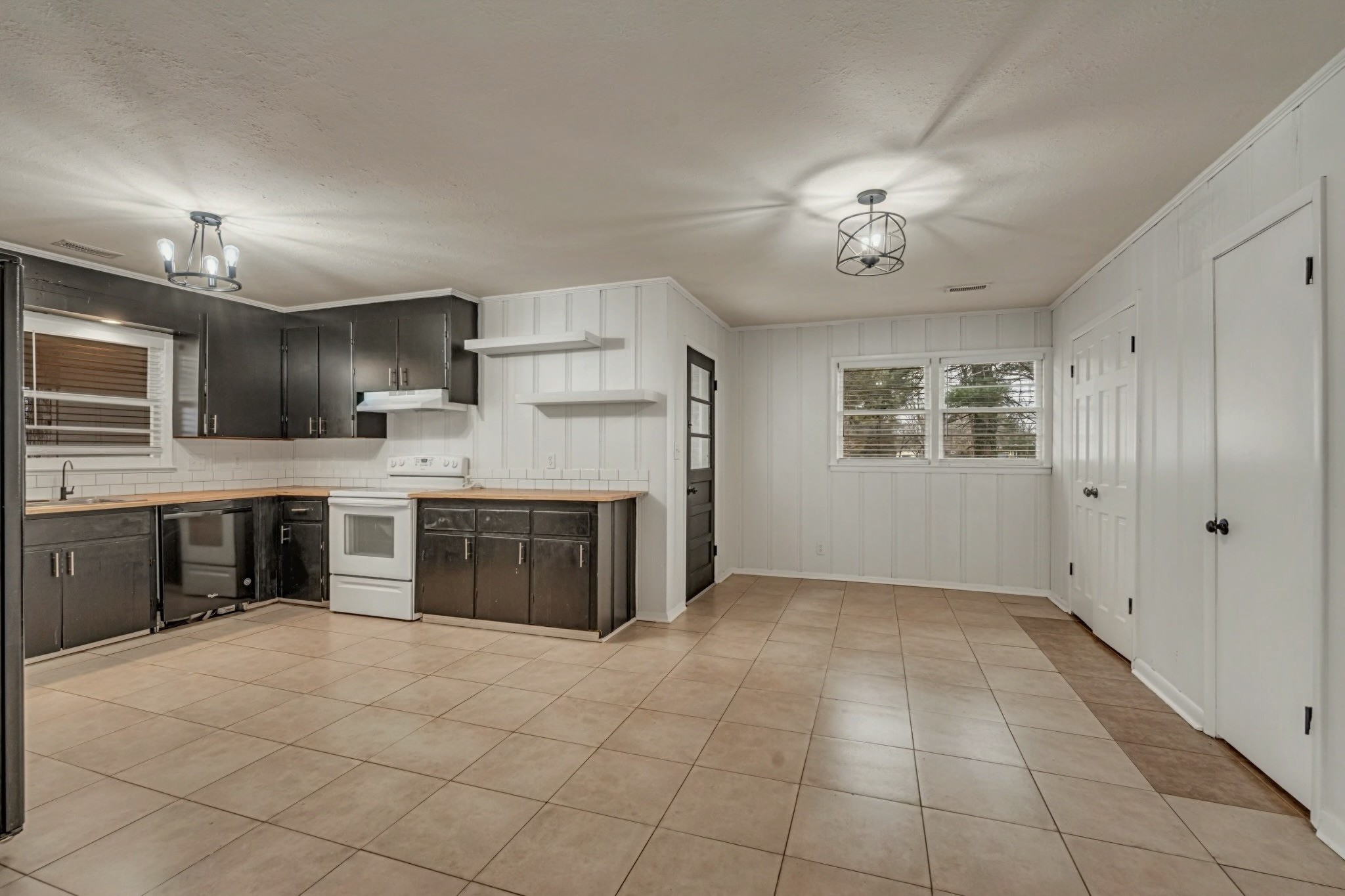 1102 North High Street Winchester, TN 37398 - Photo 7 of 27 a large kitchen with cabinets and stainless steel appliances