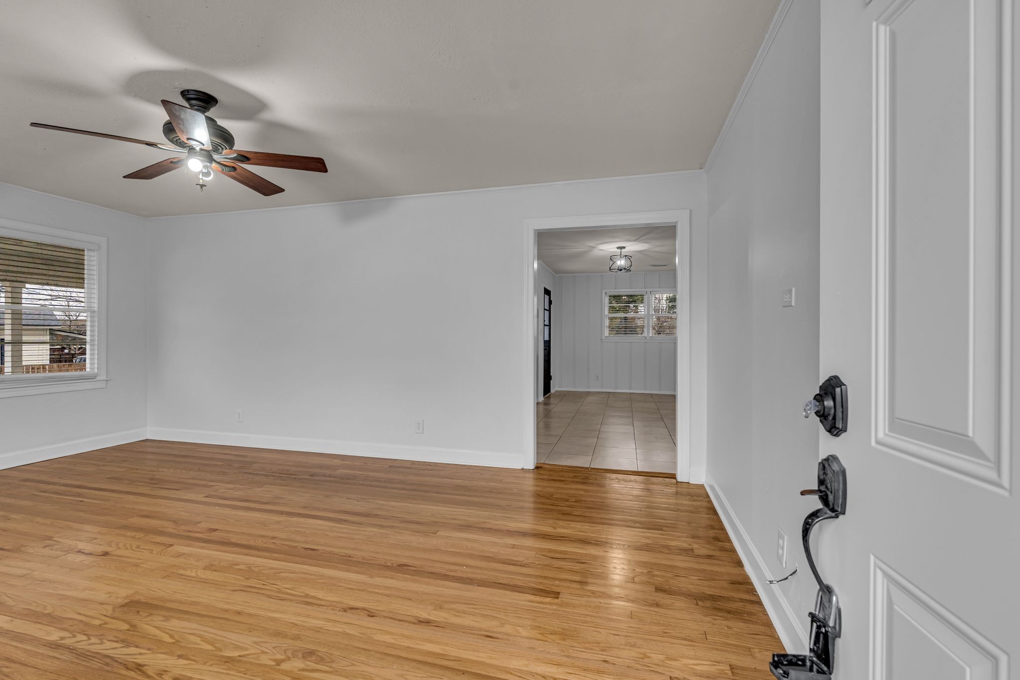1102 North High Street Winchester, TN 37398 - Photo 8 of 27 wooden floor in an empty room with a window