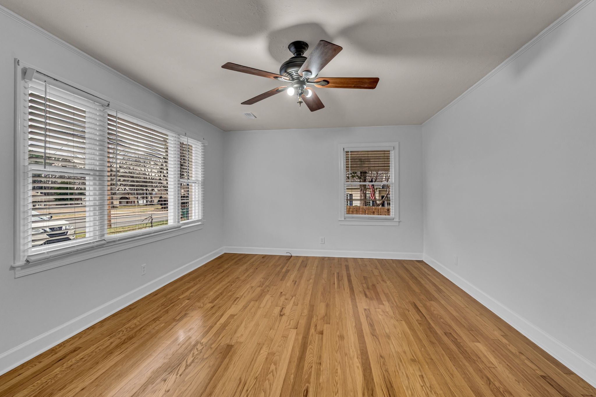 1102 North High Street Winchester, TN 37398 - Photo 10 of 27 a view of empty room with wooden floor and fan