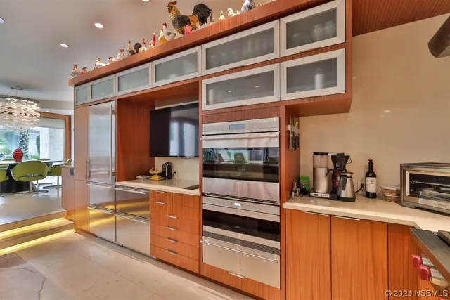 a kitchen with stainless steel appliances granite countertop a sink and cabinets