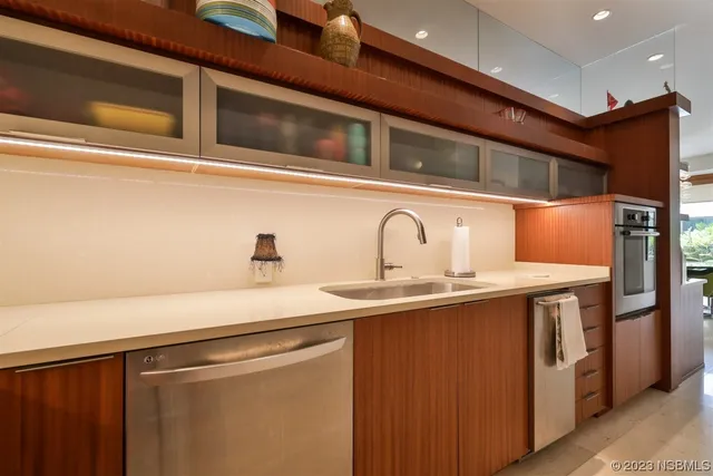 a view of a house with swimming pool and sitting area