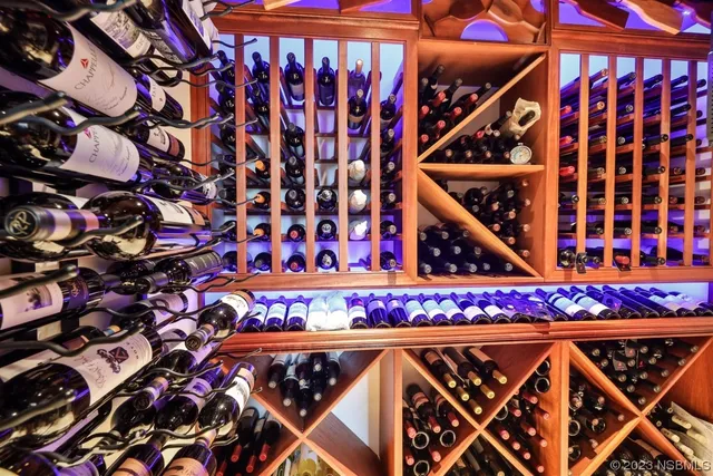 a bathroom with double vanity sinks and a mirror