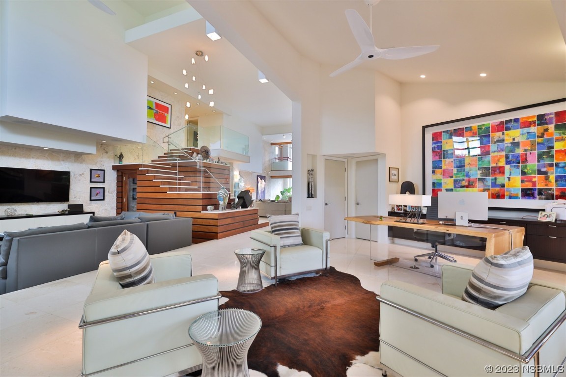 1006 South Riverside Drive Edgewater, FL 32132 - Photo 28 of 75 a living room with furniture and a flat screen tv