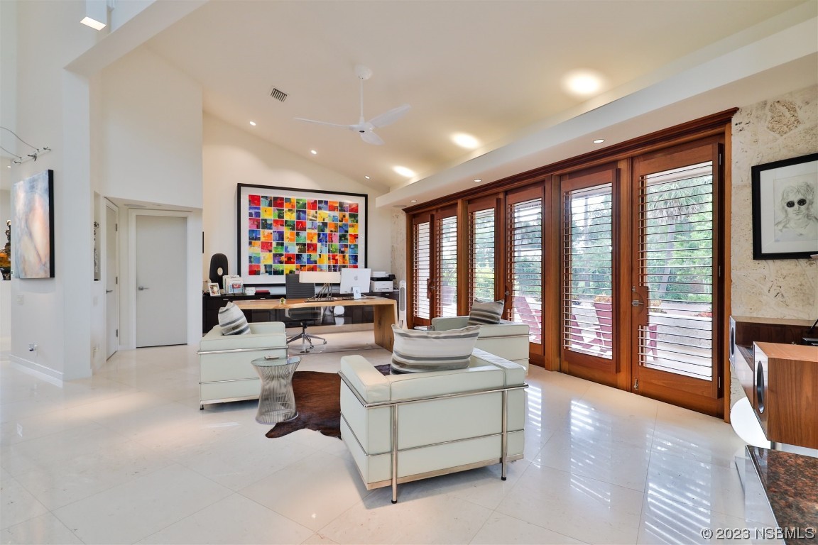 1006 South Riverside Drive Edgewater, FL 32132 - Photo 29 of 75 a living room with furniture and a large window