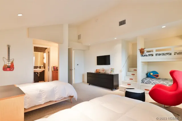 a bathroom with a toilet a sink and a mirror