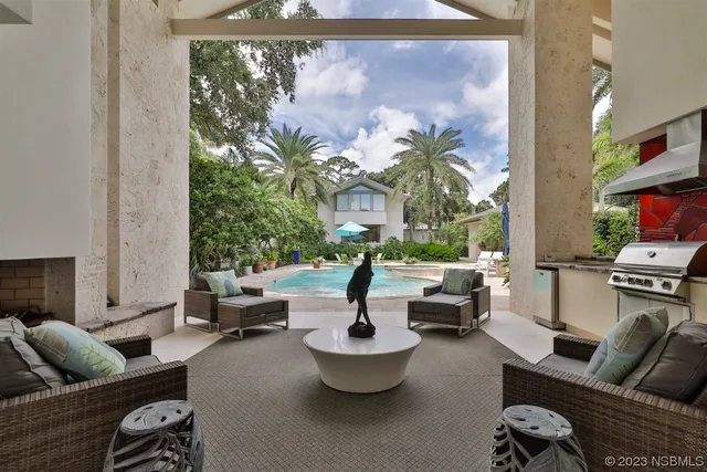 a view of a house with a backyard