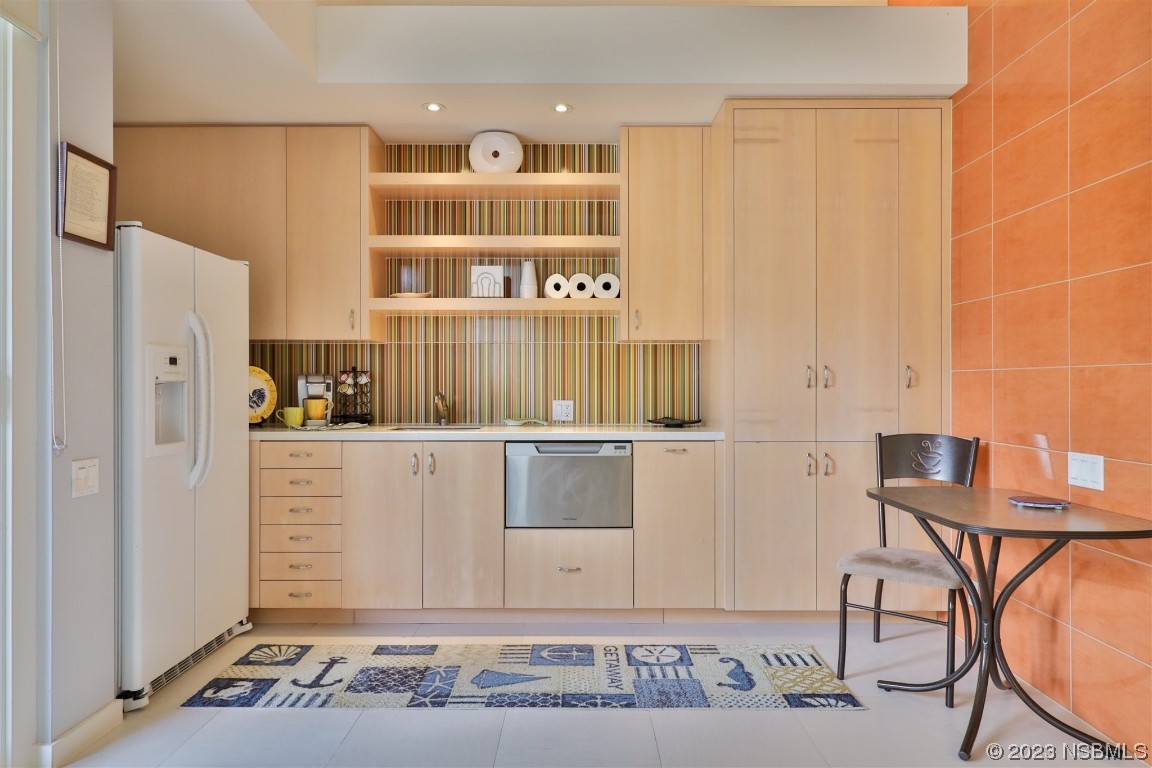 1006 South Riverside Drive Edgewater, FL 32132 - Photo 54 of 75 a view of a kitchen with cabinets and wooden floor
