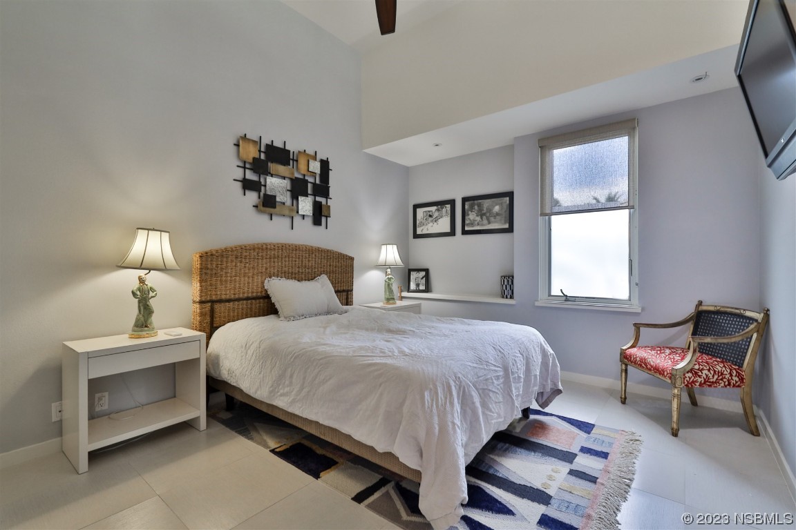 1006 South Riverside Drive Edgewater, FL 32132 - Photo 56 of 75 a bedroom with bed and window