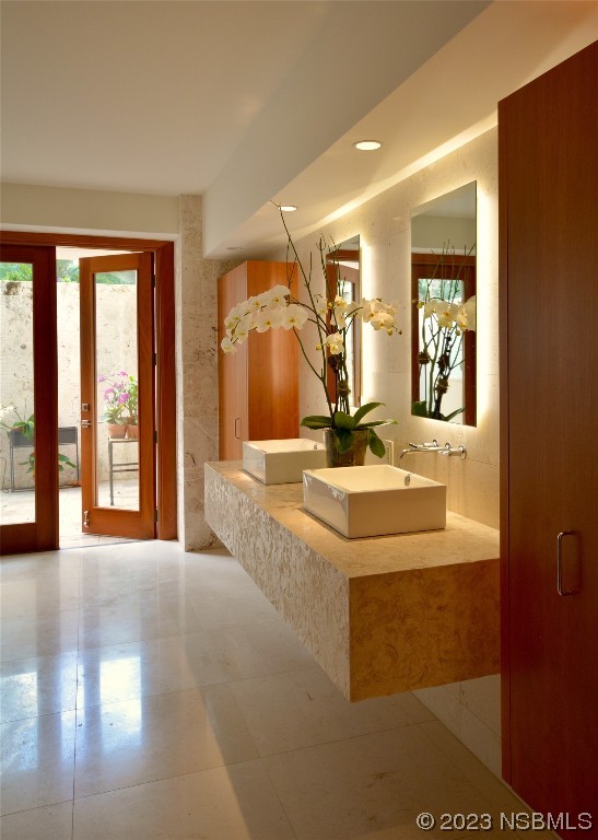 1006 South Riverside Drive Edgewater, FL 32132 - Photo 6 of 75 a bathroom with a sink and a mirror