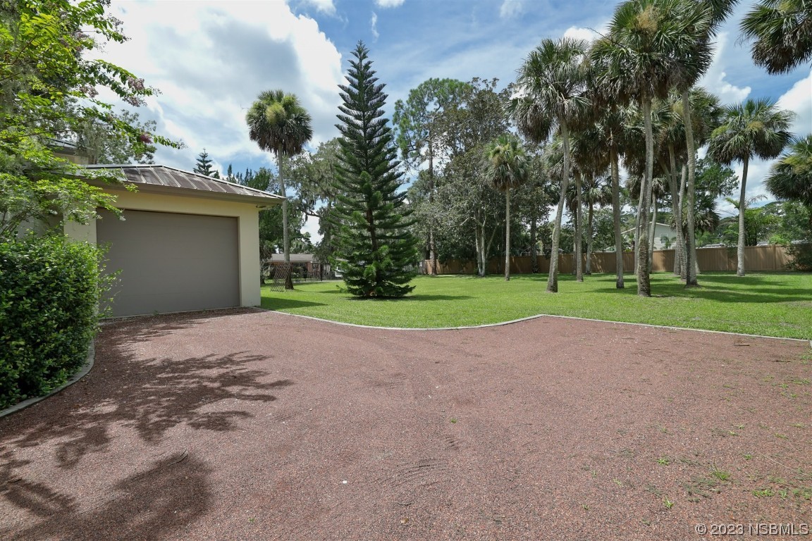 1006 South Riverside Drive Edgewater, FL 32132 - Photo 64 of 75 a view of outdoor space with garden