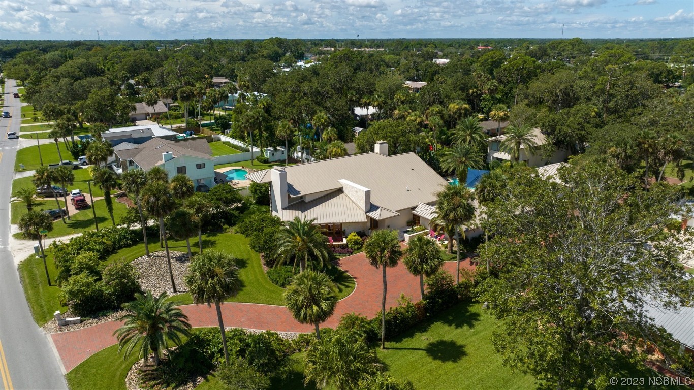 1006 South Riverside Drive Edgewater, FL 32132 - Photo 73 of 75 an aerial view of a house with a yard