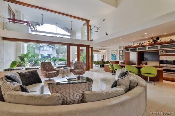 a kitchen with stainless steel appliances granite countertop a sink and a refrigerator