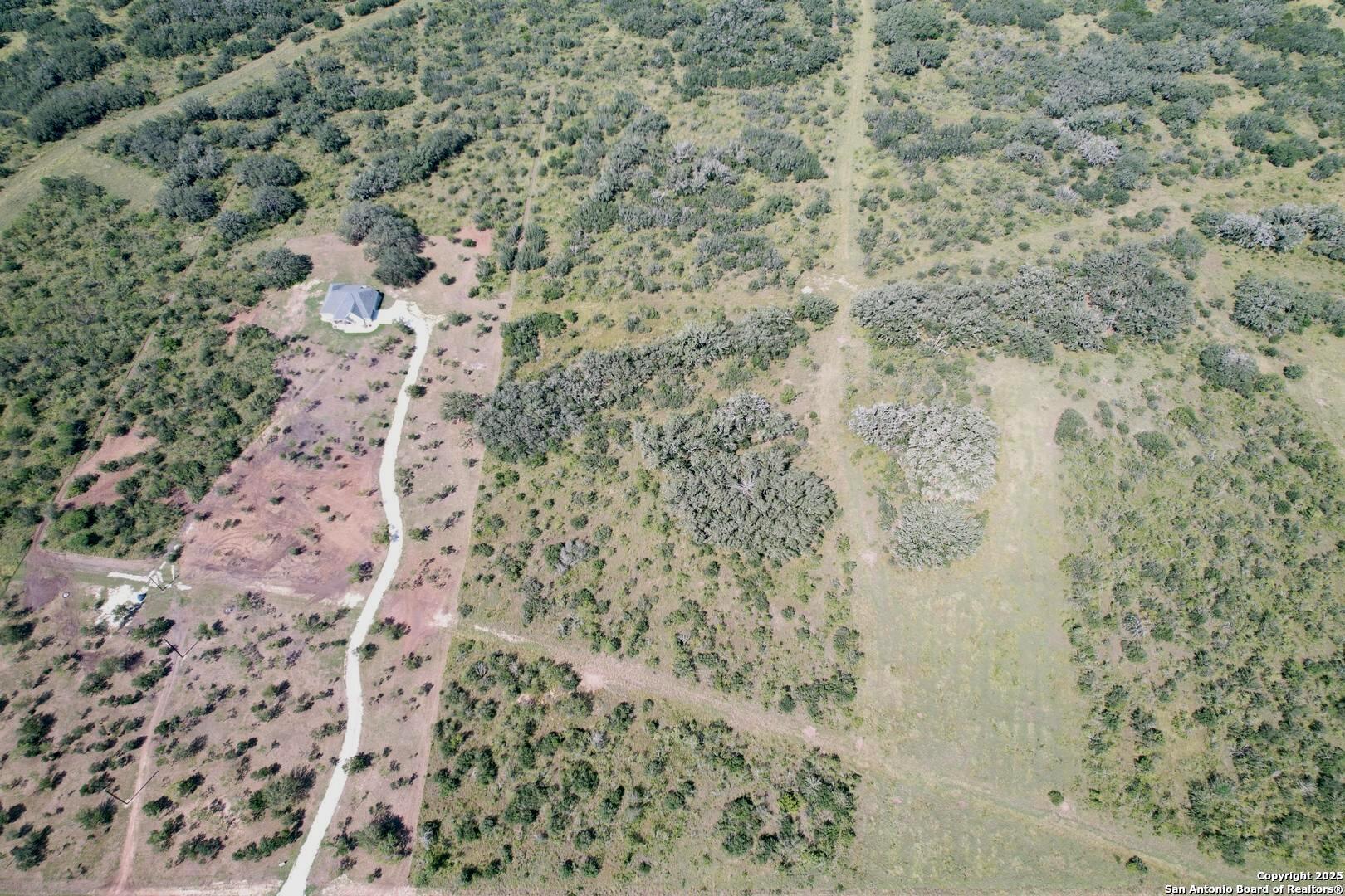33 Utopia Forest D'Hanis, TX 78850 - Photo 3 of 19 a bathroom with a shower curtain