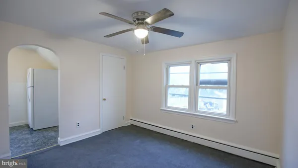 a view of a balcony with furniture and wooden floor