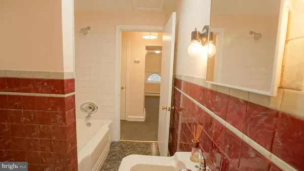 a bathroom with a toilet and a sink