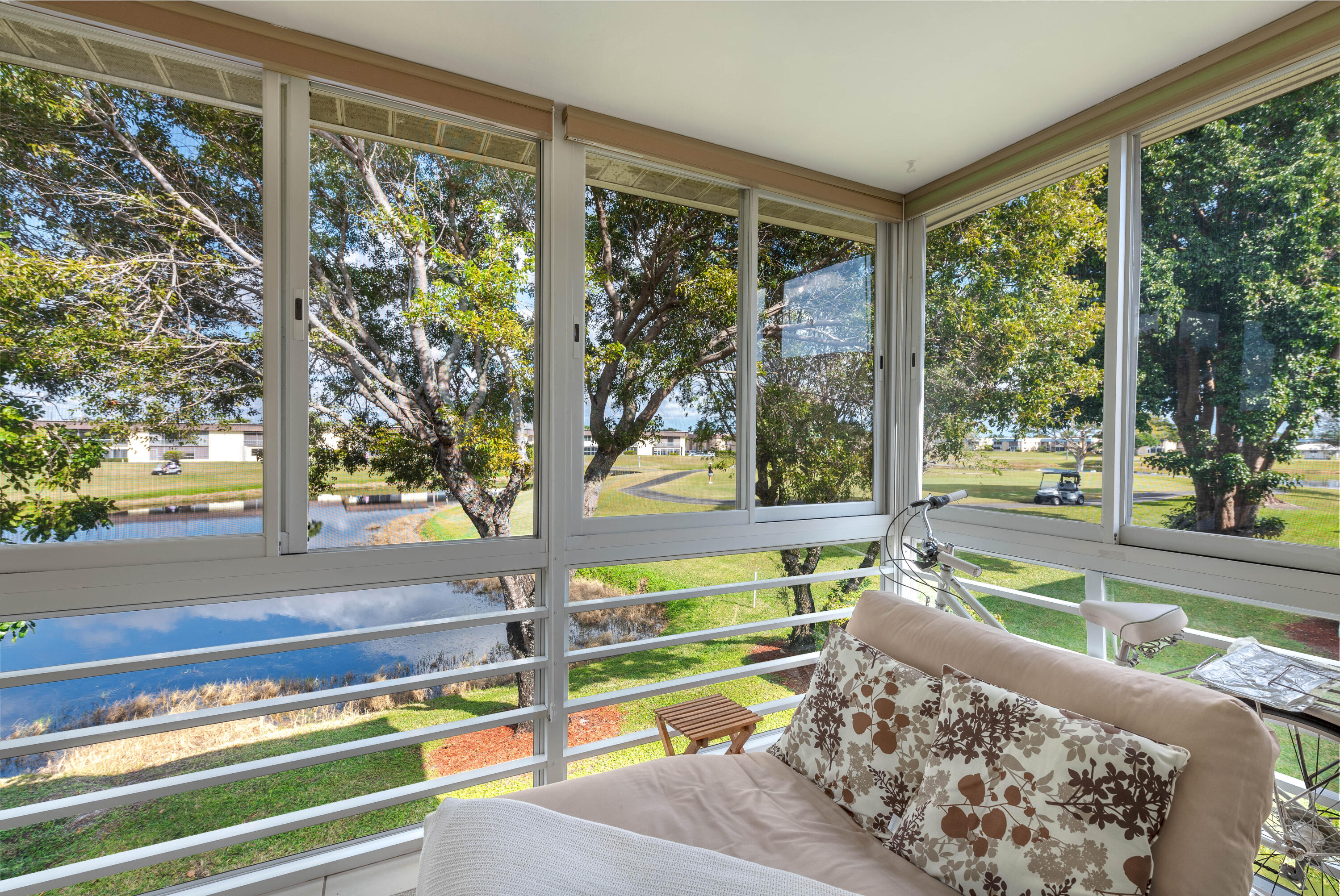369 Capri H Delray Beach, FL 33484 - Photo 1 of 37 a living room with large windows