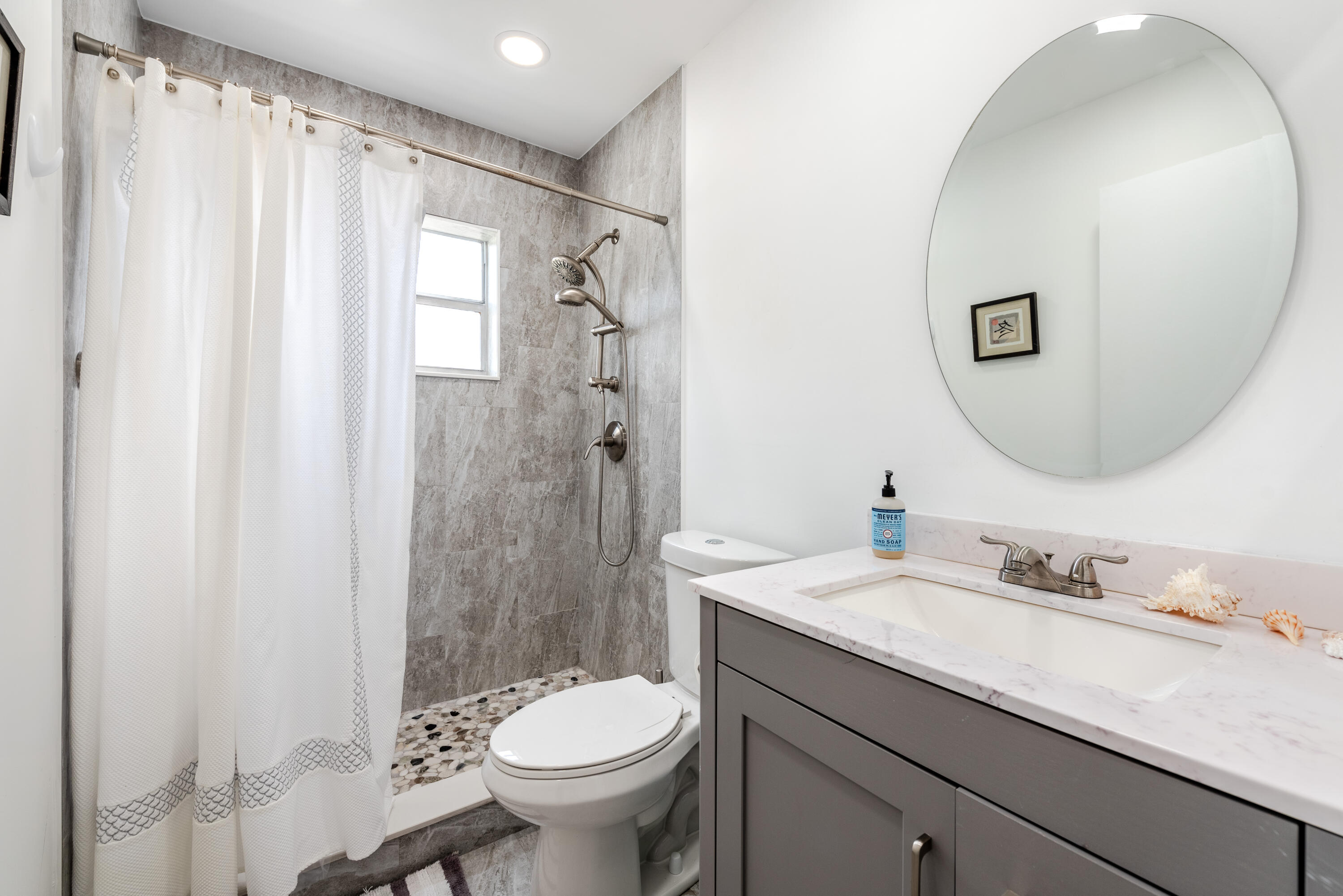 369 Capri H Delray Beach, FL 33484 - Photo 11 of 37 a bathroom with a sink toilet and shower