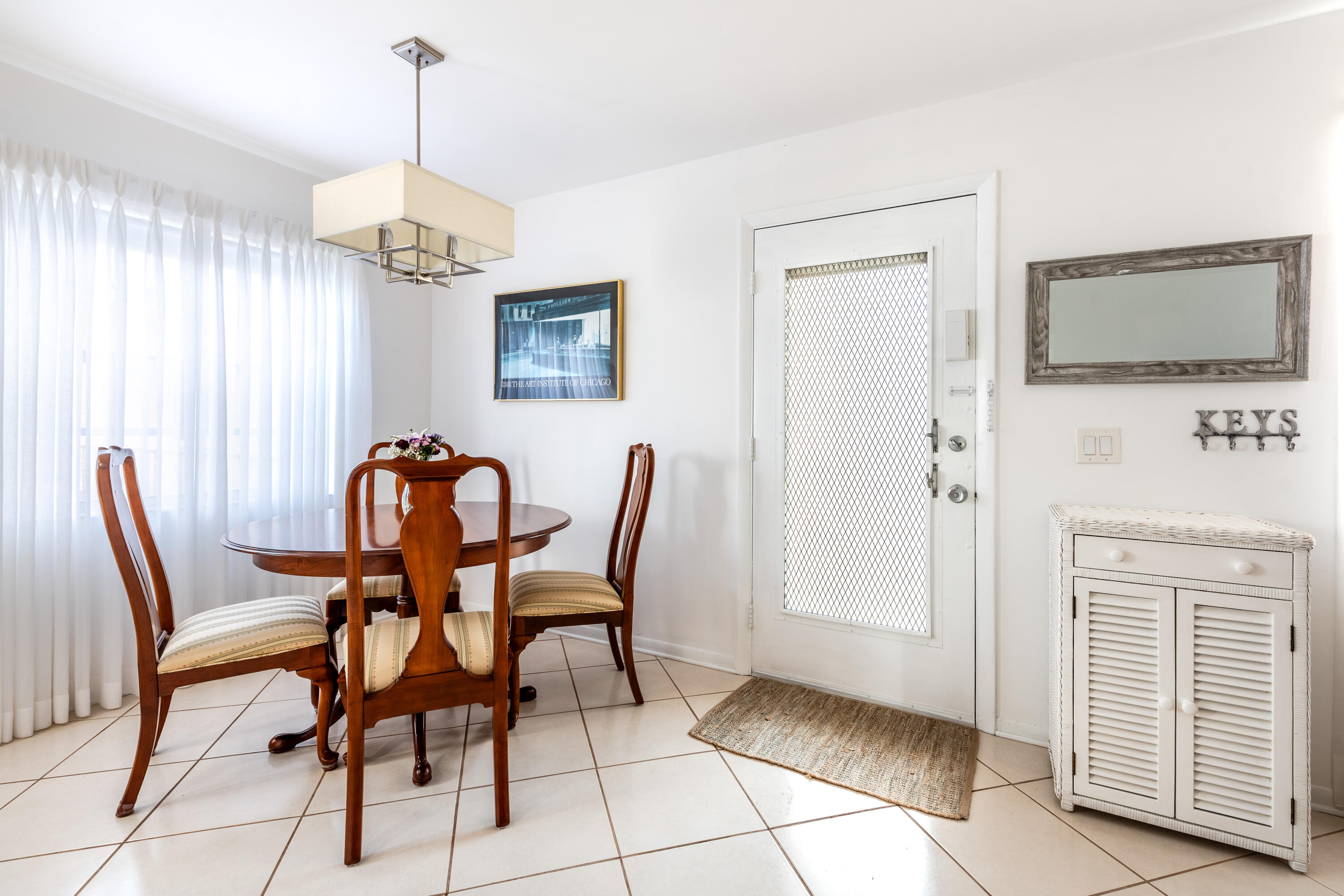369 Capri H Delray Beach, FL 33484 - Photo 3 of 37 a view of a dining room with furniture wooden floor and chandelier