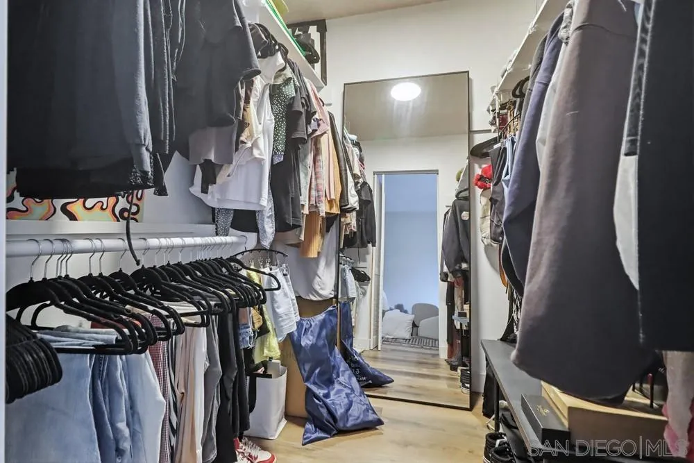 6416 Friars Road, Unit 111 San Diego, CA 92108 - Photo 12 of 21 a view of walk in closet with clothes