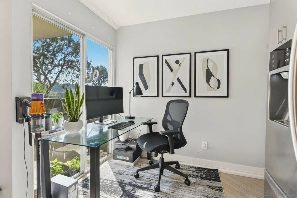 6416 Friars Road, Unit 111 San Diego, CA 92108 - Photo 7 of 21 a work room with furniture and wooden floor