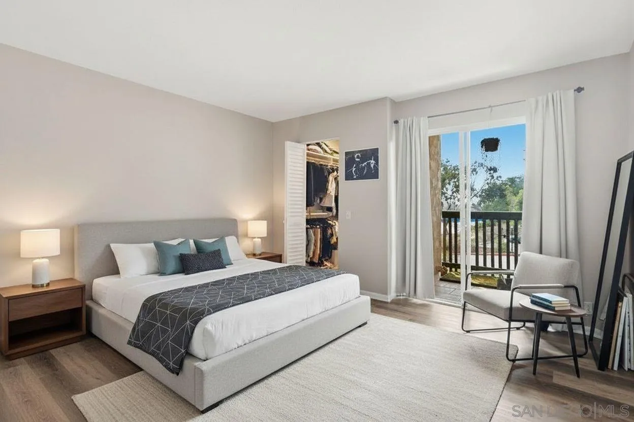 6416 Friars Road, Unit 111 San Diego, CA 92108 - Photo 9 of 21 a bedroom with a bed large mirror and a desk