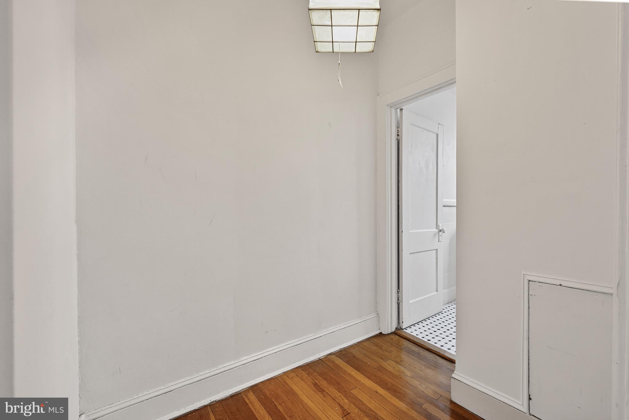 1820 Clydesdale Place Northwest, Unit 411 Washington, DC 20009 - Photo 15 of 33 a view of an empty room with wooden floor and a window