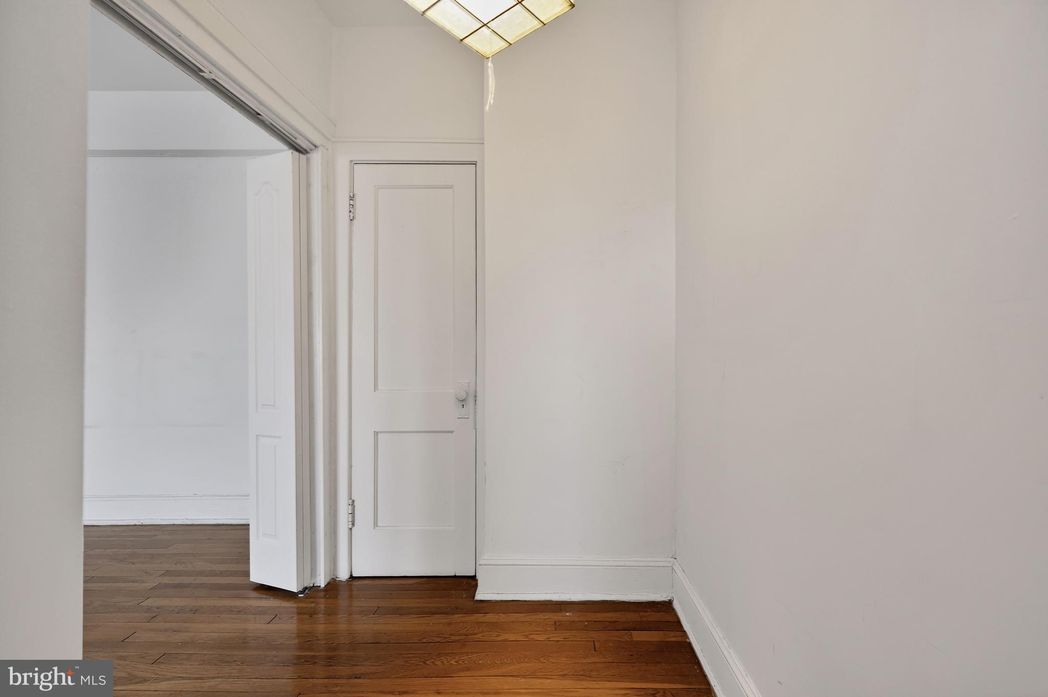 1820 Clydesdale Place Northwest, Unit 411 Washington, DC 20009 - Photo 16 of 33 a view of empty room with wooden floor