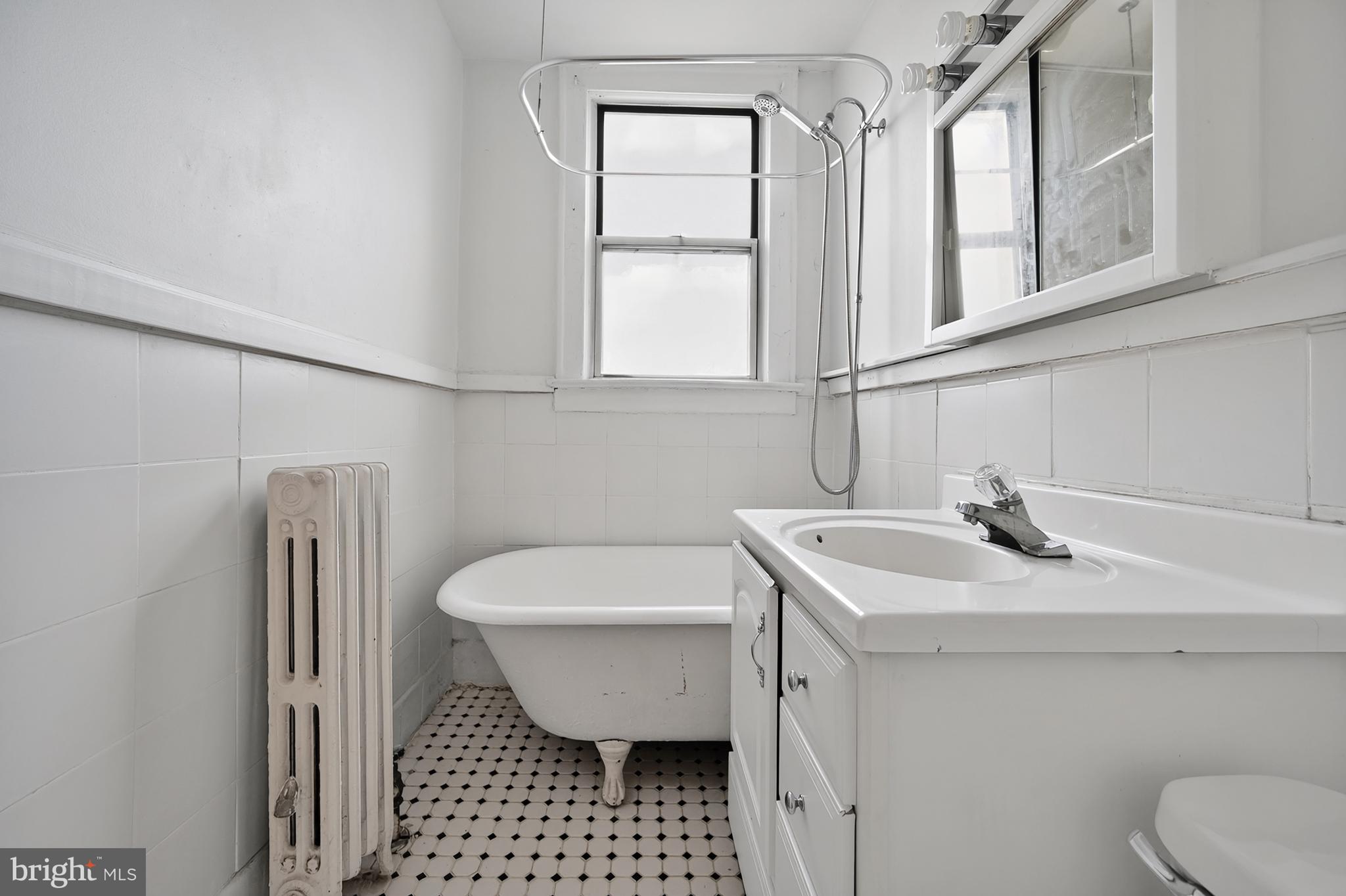 1820 Clydesdale Place Northwest, Unit 411 Washington, DC 20009 - Photo 18 of 33 a bathroom with a sink toilet and shower