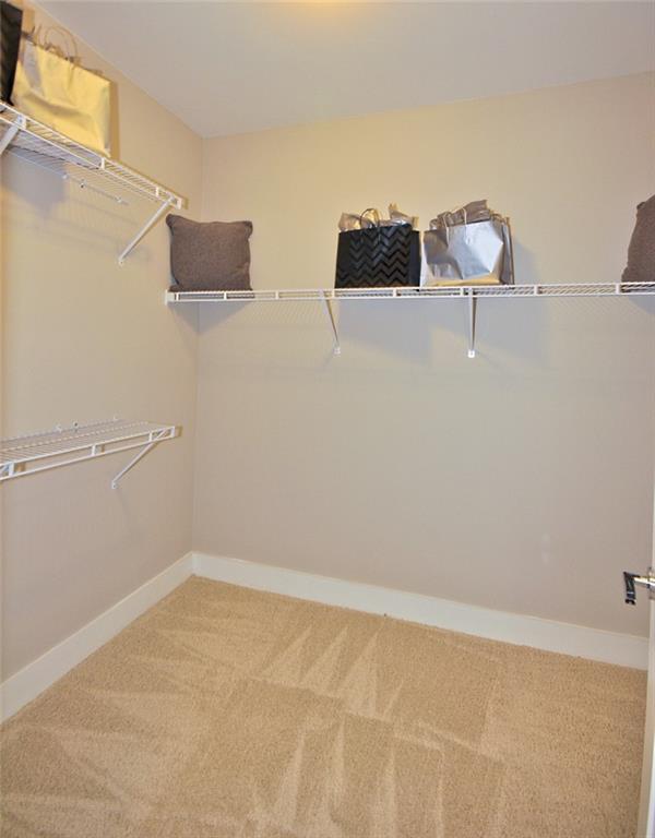 2875 Crescent Parkway, Unit 1117 Smyrna, GA 30080 - Photo 13 of 23 a view of a room with racks on the wall