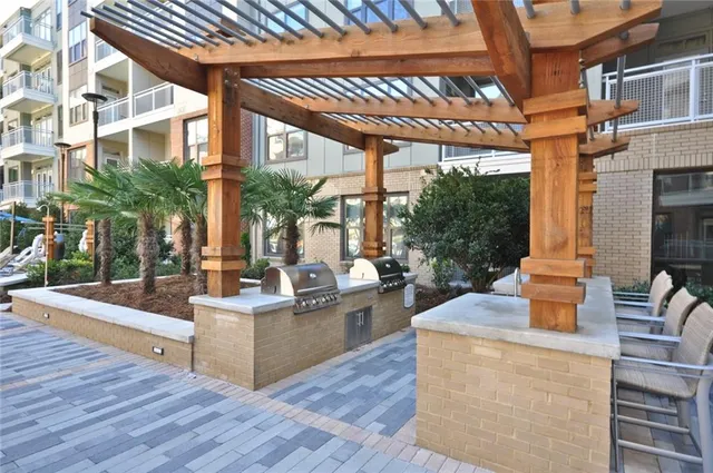 a view of a patio with couches and potted plants