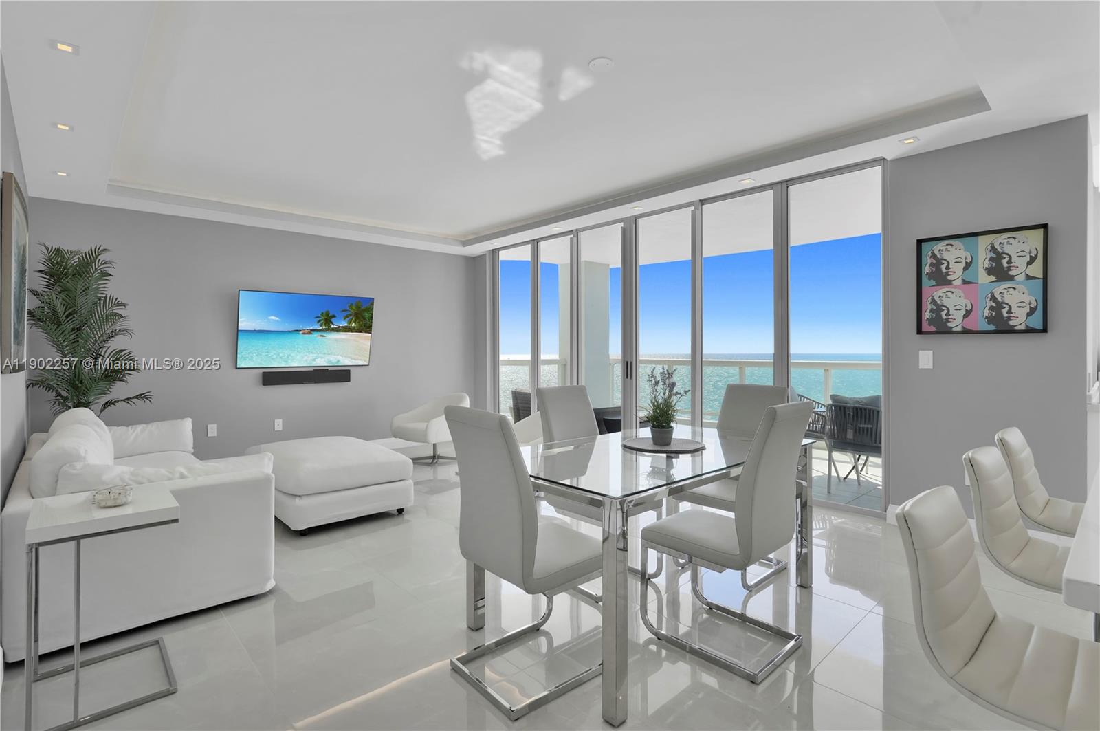 4201 Collins Avenue, Unit 2101 Miami Beach, FL 33140 - Photo 14 of 50 a view of a livingroom with furniture and a large window