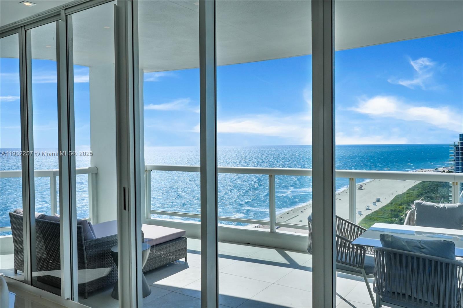4201 Collins Avenue, Unit 2101 Miami Beach, FL 33140 - Photo 21 of 50 a bathroom with a glass door